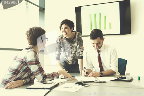 Image of young business people group on meeting at modern office