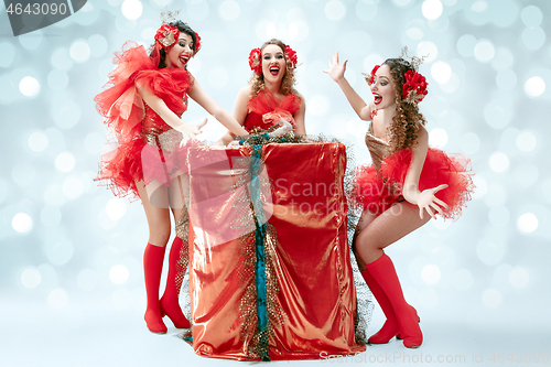 Image of young beautiful dancers posing on studio background