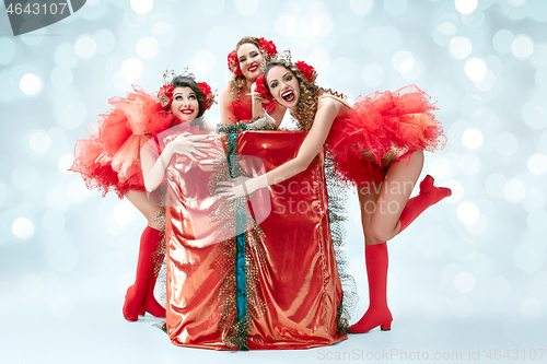 Image of young beautiful dancers posing on studio background