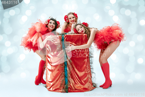 Image of young beautiful dancers posing on studio background