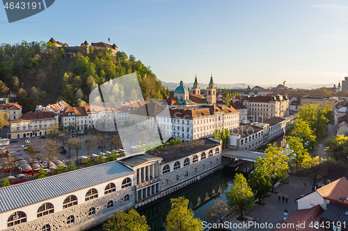 Image of Aerial drone panoramic view of Ljubljana medieval city center, capital of Slovenia in warm afternoon sun. Empty streets during corona virus pandemic social distancing measures