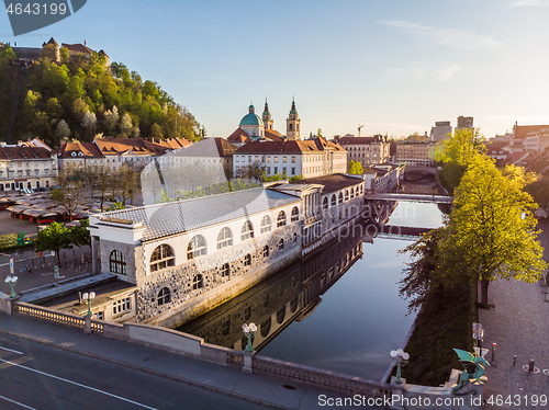 Image of Aerial drone panoramic view of Ljubljana medieval city center, capital of Slovenia in warm afternoon sun. Empty streets during corona virus pandemic social distancing measures