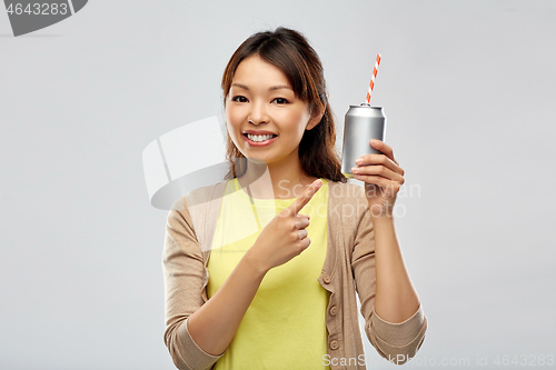 Image of happy asian woman with can drink