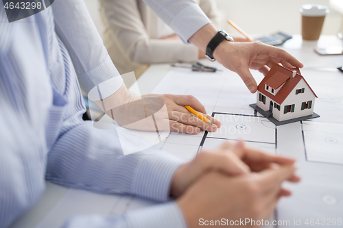 Image of close up of architects discussing house project