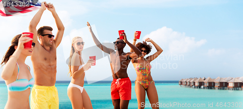 Image of friends at american independence day beach party