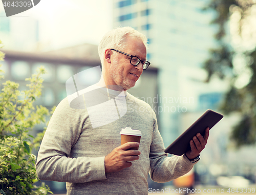 Image of senior man with tablet pc and coffee in city