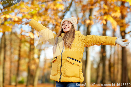 Image of happy girl at autumn park