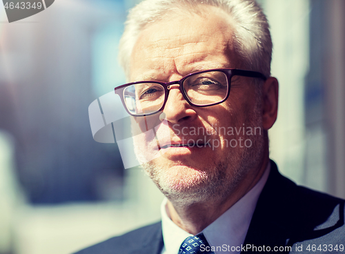 Image of close up of senior businessman in eyeglasses