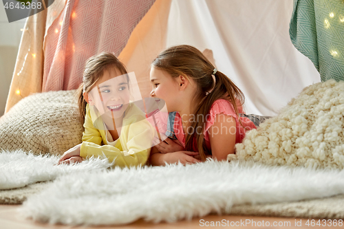 Image of little girls talking in kids tent at home