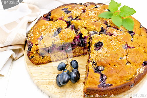 Image of Pie with black grapes on light board