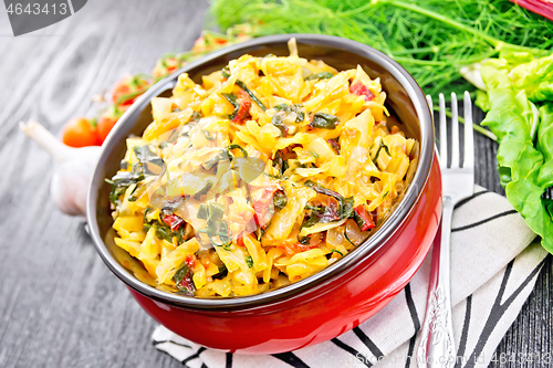 Image of Cabbage stew with chard in bowl on towel