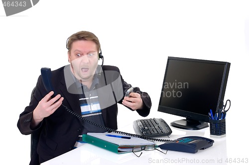 Image of Stressed businessman on desk 