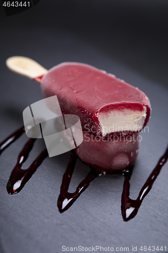 Image of Fruit ice cream stick looks fresh to eat placed on black 