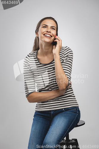 Image of Beautiful woman talking on phone