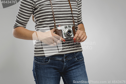 Image of Woman with her vintage camera