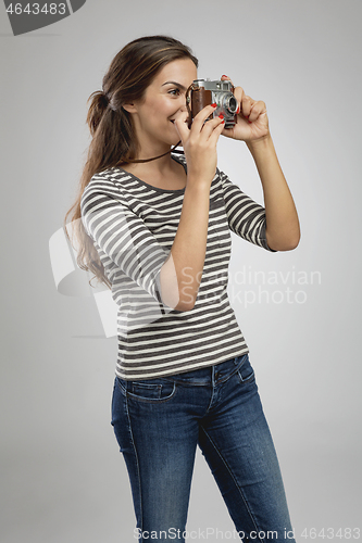 Image of Beautiful woman photographing