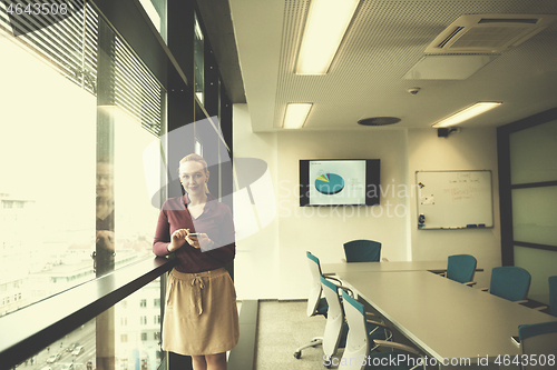 Image of young business woman using smart phone