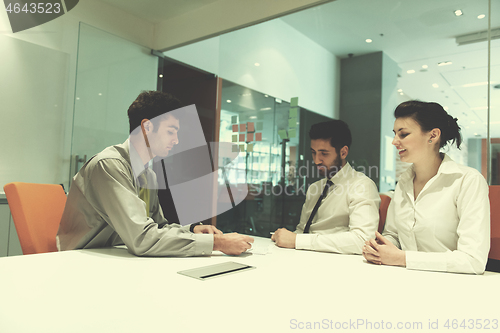 Image of young couple signing contract documents on partners back