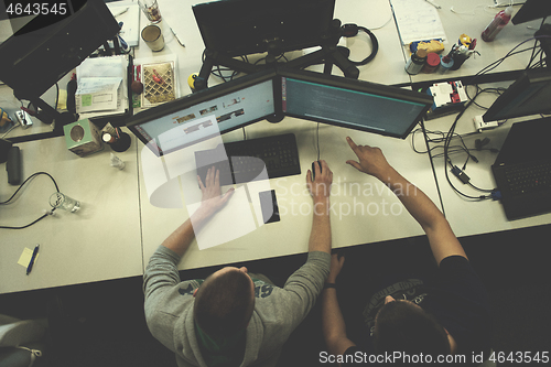 Image of young programmers writing programming code top view