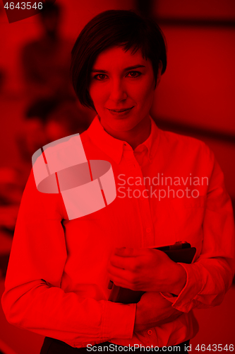 Image of hispanic businesswoman with tablet at meeting room