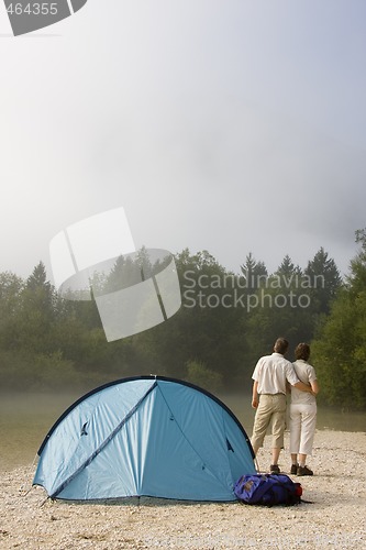 Image of Couple beside a tent in the mountains