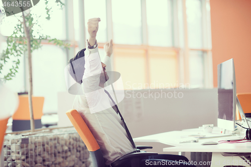 Image of young business man  working on desktop computer