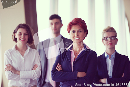 Image of diverse business people group with redhair  woman in front