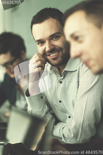 Image of Business Team At A Meeting at modern office building