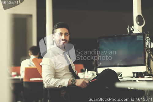 Image of young business man  working on desktop computer