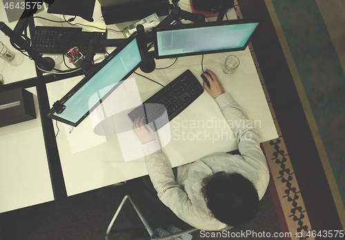 Image of young programmer writing programming code top view