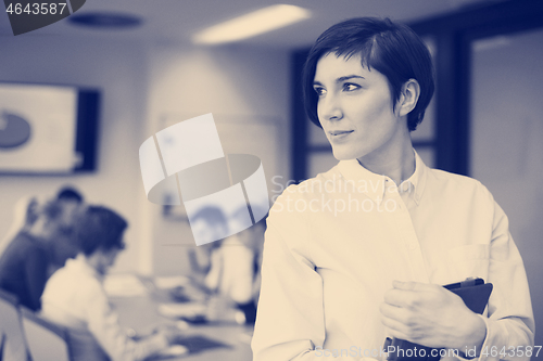 Image of business woman on meeting  using tablet computer