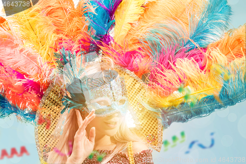 Image of Beautiful young woman in carnival mask