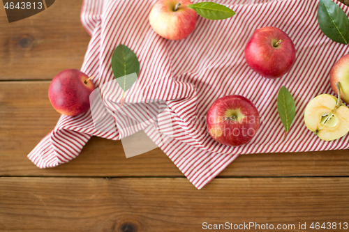 Image of ripe red apples on wooden table