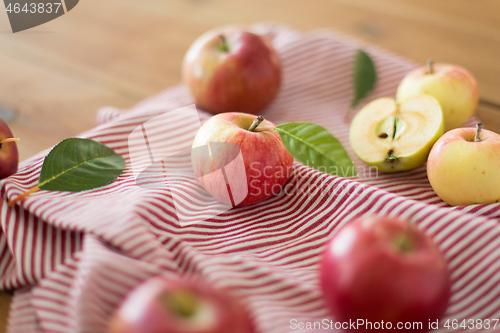 Image of ripe red apples on wooden table