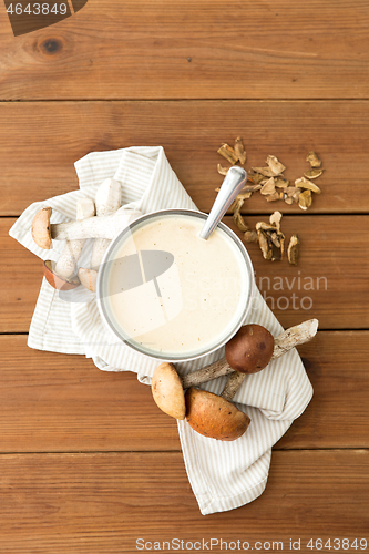 Image of mushroom cream soup in bowl on cutting board