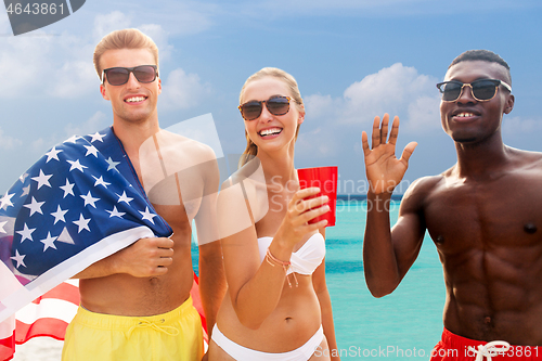 Image of friends at american independence day beach party