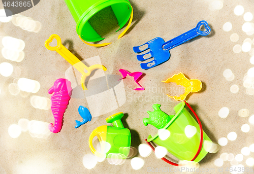 Image of close up of sand toys kit on summer beach