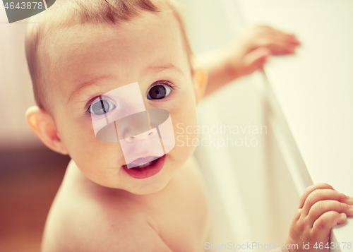 Image of happy little baby boy or girl at home