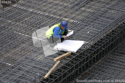 Image of Project Manager reading the site plans