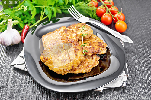 Image of Fritters meat in plate on wooden board