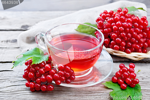 Image of Tea from viburnum in cup on old wooden board