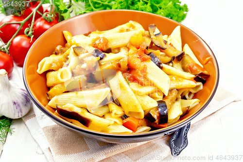 Image of Pasta penne with eggplant and tomatoes on board