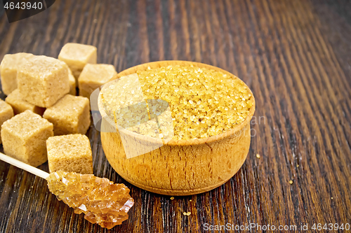 Image of Sugar brown in wooden bowl on board