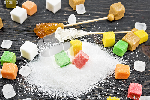 Image of Sugar of different colors and shapes on board