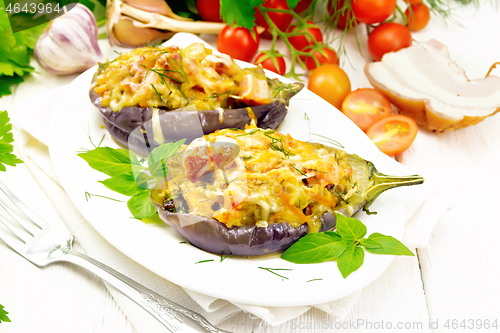 Image of Eggplant stuffed smoked brisket in plate on white board