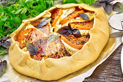 Image of Galeta with tomato and cheese on board