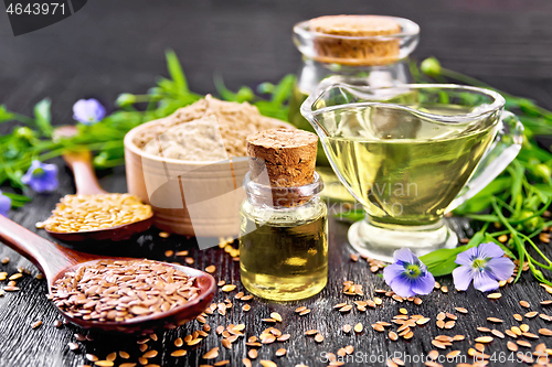 Image of Oil flaxseed with flour and seeds on board