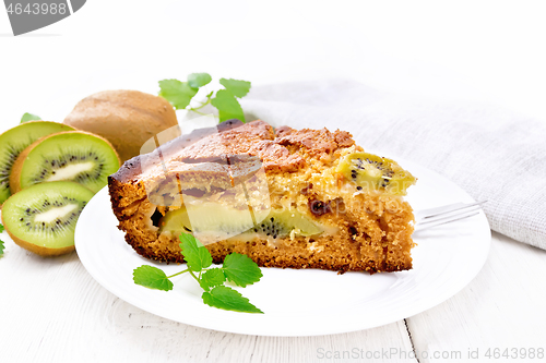 Image of Pie with kiwi in plate on white board