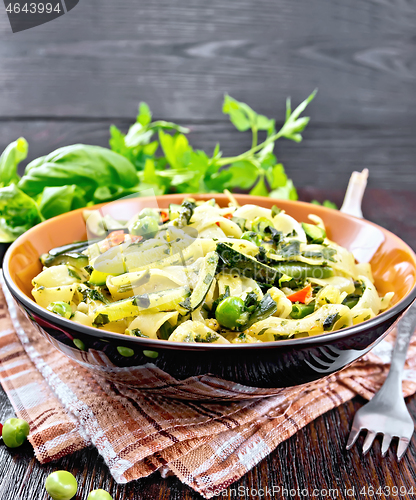 Image of Tagliatelle with green vegetables on kitchen towel