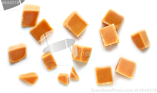 Image of caramel pieces on white background